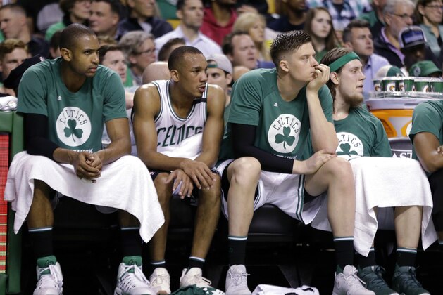 Boston Celtics, from left, Al Horford, Avery Bradley, Jonas Jerebko and Kelly Olynyk watch from the bench during the second half of Game 5 of the NBA basketball Eastern Conference finals against the Cleveland Cavaliers, on Thursday, May 25, 2017, in Boston. (AP Photo/Elise Amendola)