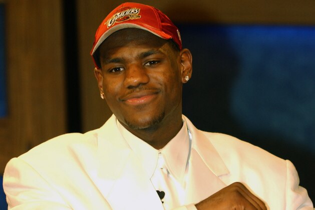 NEW YORK - JUNE 26:  LeBron James who was selected by the Cleveland Cavaliers reacts during the 2003 NBA Draft at the Paramount Theatre at Madison Square Garden on June 26, 2003 in New York, New York.  NOTE TO USER: User expressly acknowledges and agrees that, by downloading and/or using this Photograph, User is consenting to the terms and conditions of the Getty Images License Agreement.  Copyright 2003 NBAE  (Photo by Jesse D. Garrabrant/NBAE via Getty Images)