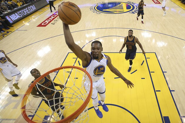 Golden State Warriors forward Kevin Durant (35) dunks against the Cleveland Cavaliers during the first half of Game 1 of basketball's NBA Finals in Oakland, Calif., Thursday, June 1, 2017. (Ezra Shaw/Pool Photo via AP)