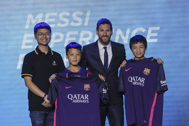 BEIJING, CHINA - JUNE 01:  FC Barcelona's striker Lionel Messi poses for a photo with Chinese fans during a press conference at China World Trade Center Grand Hotel on June 1, 2017 in Beijing, China. Messi arrived in China to attend an event related to the Messi soccer Eco Experience Pavilion. The park is to be build in Nanjing and will be the largest theme park in the world.  (Photo by Lintao Zhang/Getty Images)