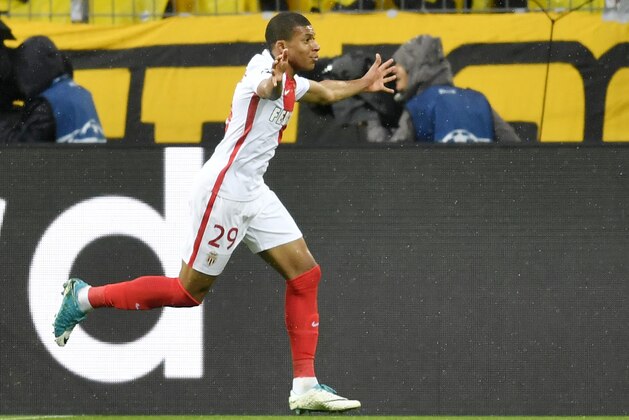 Monaco's Kylian Mbappe celebrates after scoring the opening goal during the Champions League quarterfinal first leg soccer match between Borussia Dortmund and AS Monaco in Dortmund, Germany, Wednesday, April 12, 2017. (AP Photo/Martin Meissner)