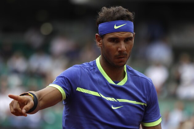 Spain's Rafael Nadal gestures as he plays Georgia's Nikoloz Basilashvili during their third round match of the French Open tennis tournament at the Roland Garros stadium, Friday, June 2, 2017 in Paris. (AP Photo/Petr David Josek)