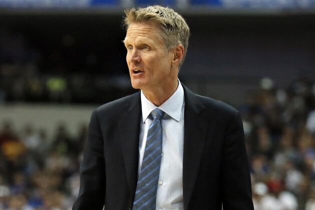Golden State Warriors head coach Steve Kerr watches play against the Dallas Mavericks during an NBA basketball game, Tuesday, March 21, 2017, in Dallas. (AP Photo/Tony Gutierrez)