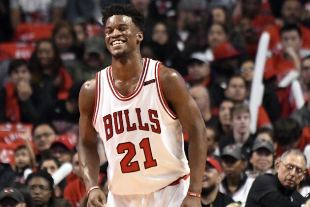 Chicago Bulls forward Jimmy Butler (21) smiles during the first half of an NBA basketball game against the Brooklyn Nets in Chicago, Wednesday, April 12, 2017. (AP Photo/David Banks)