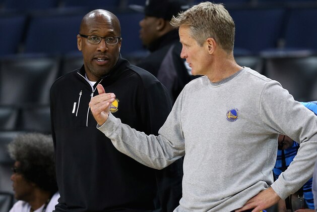 OAKLAND, CA - MAY 31:  Interim head coach Mike Brown speaks to head coach Steve Kerr of the Golden State Warriors during a practice for the 2017 NBA Finals at ORACLE Arena on May 31, 2017 in Oakland, California. NOTE TO USER: User expressly acknowledges and agrees that, by downloading and or using this photograph, User is consenting to the terms and conditions of the Getty Images License Agreement.  (Photo by Ezra Shaw/Getty Images)