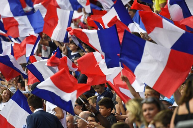 France supporters waves flags prior to the friendly football match between France and Paraguay on June 2, 2017, at the Roazhon Park stadium in Rennes, western France. / AFP PHOTO / DAMIEN MEYER        (Photo credit should read DAMIEN MEYER/AFP/Getty Images)