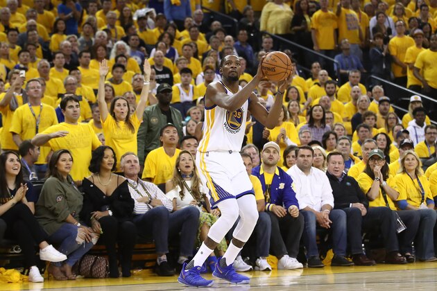 OAKLAND, CA - JUNE 01: Kevin Durant #35 of the Golden State Warriors attempts a jump shot against the Cleveland Cavaliers in Game 1 of the 2017 NBA Finals at ORACLE Arena on June 1, 2017 in Oakland, California. NOTE TO USER: User expressly acknowledges and agrees that, by downloading and or using this photograph, User is consenting to the terms and conditions of the Getty Images License Agreement.  (Photo by Ezra Shaw/Getty Images)