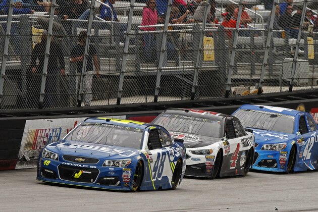 Driver Jimmie Johnson (48) leads Kevin Harvick (4) and Kyle Larson (42) during a NASCAR Monster Energy NASCAR Cup Series auto race, Monday, April 24, 2017 in Bristol, Tenn. (AP Photo/Wade Payne)