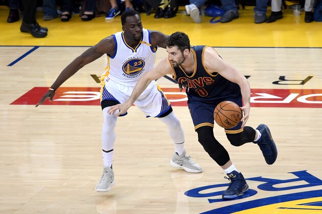 OAKLAND, CA - JUNE 01:  Kevin Love #0 of the Cleveland Cavaliers drives with the ball against Draymond Green #23 of the Golden State Warriors in Game 1 of the 2017 NBA Finals at ORACLE Arena on June 1, 2017 in Oakland, California. NOTE TO USER: User expressly acknowledges and agrees that, by downloading and or using this photograph, User is consenting to the terms and conditions of the Getty Images License Agreement.  (Photo by Thearon W. Henderson/Getty Images)