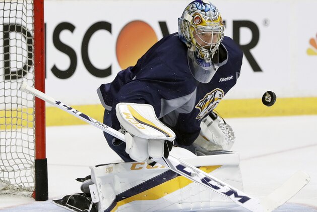 Nashville Predators goalie Pekka Rinne, of Finland, blocks a shot during practice Friday, June 2, 2017, in Nashville, Tenn. The Predators are scheduled to face the Pittsburgh Penguins in Game 3 of the NHL hockey Stanley Cup Finals Saturday. (AP Photo/Mark Humphrey)