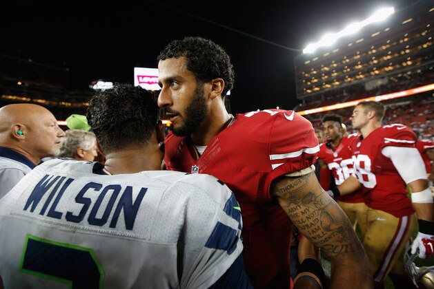 SANTA CLARA, CA - OCTOBER 22:  Colin Kaepernick #7 of the San Francisco 49ers shakes hands with Russell Wilson #3 of the Seattle Seahawks after the Seahawks won their game at Levi's Stadium on October 22, 2015 in Santa Clara, California.  (Photo by Ezra Shaw/Getty Images)