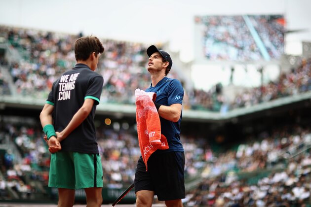 PARIS, FRANCE - JUNE 03: Andy Murray of Great Britain hands his towel back to the ball boy during the mens singles third round match against Juan Martin Del Potro of Argentina on day seven of the 2017 French Open at Roland Garros on June 3, 2017 in Paris, France.  (Photo by Julian Finney/Getty Images)