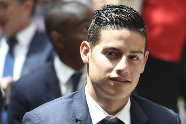 Real Madrid's Colombian midfielder James Rodriguez smiles at the Madrid Community headquarters, in Madrid on May 22, 2017 during a celeration after the team won the Spanish league football tournament.
Madrid sealed a first La Liga title in five years yesterday -- and 33rd in total -- with a 2-0 victory at Malaga to bring a halt to Barcelona's domination of domestic matters having won six of the previous eight titles.

 / AFP PHOTO / CURTO DE LA TORRE        (Photo credit should read CURTO DE LA TORRE/AFP/Getty Images)