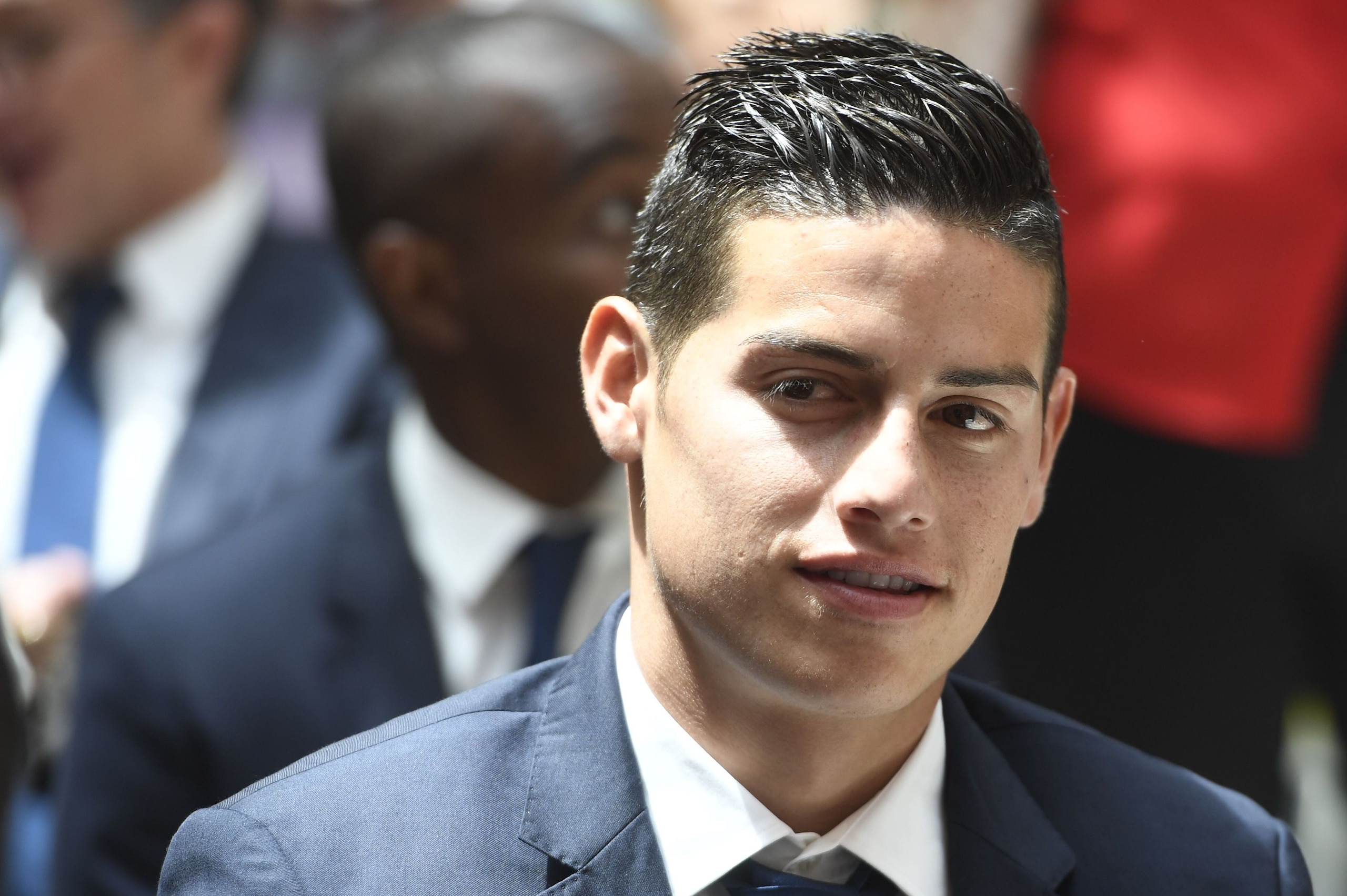 Real Madrid's Colombian midfielder James Rodriguez smiles at the Madrid Community headquarters, in Madrid on May 22, 2017 during a celeration after the team won the Spanish league football tournament.
Madrid sealed a first La Liga title in five years yesterday -- and 33rd in total -- with a 2-0 victory at Malaga to bring a halt to Barcelona's domination of domestic matters having won six of the previous eight titles.

 / AFP PHOTO / CURTO DE LA TORRE        (Photo credit should read CURTO DE LA TORRE/AFP/Getty Images)