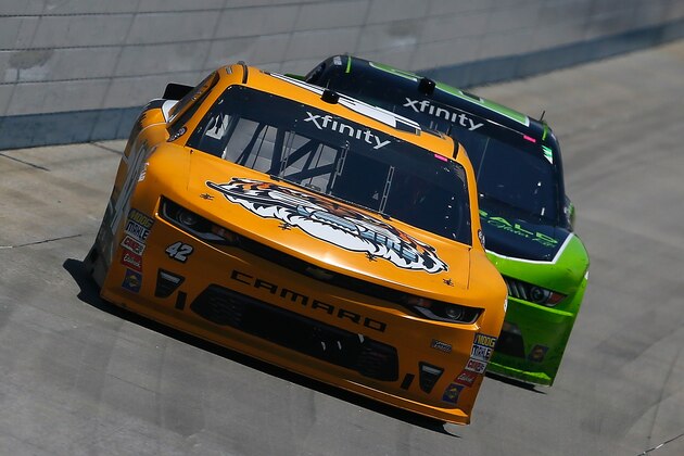 DOVER, DE - JUNE 03:  Kyle Larson, driver of the #42 Parker Store Chevrolet, races Ryan Blaney, driver of the #22 Fitzgerald Ford, during the NASCAR XFINITY Series OneMain Financial 200 at Dover International Speedway on June 3, 2017 in Dover, Delaware.  (Photo by Sean Gardner/Getty Images)