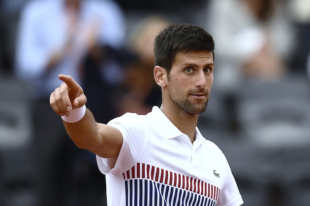 Serbia's Novak Djokovic celebrates after a point against Argentina's Diego Schwartzman during their tennis match at the Roland Garros 2017 French Open on June 2, 2017 in Paris.  / AFP PHOTO / CHRISTOPHE SIMON        (Photo credit should read CHRISTOPHE SIMON/AFP/Getty Images)