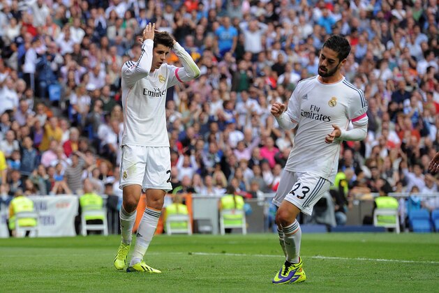 MADRID, SPAIN - OCTOBER 19:  Alvaro Morata (L) of Real Madrid CF reacts beside Isco during the La Liga match between Real Madrid CF and Malaga CF at the Santiago Bernabeu stadium on October 19, 2013 in Madrid, Spain.  (Photo by Denis Doyle/Getty Images)