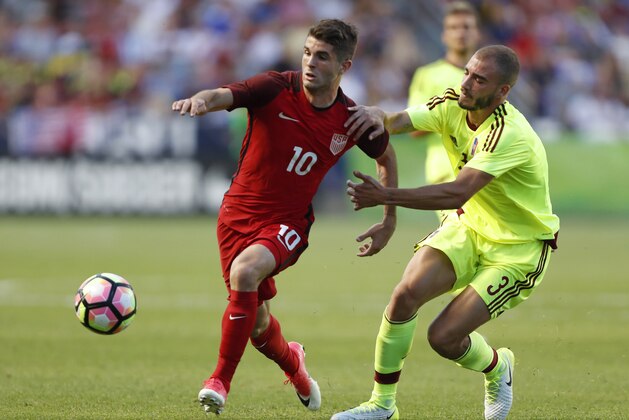 SANDY, UT - JUNE 3:  United States midfielder Christian Pulisic #10 fights for the ball with Venezuela's defender Mikel Villanueva #3 during the first half of an international friendly soccer game on June 3, 2017 at Rio Tinto Stadium in Sandy, Utah. (Photo by George Frey/Getty Images)