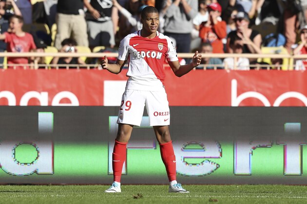 Monaco's French forward Kylian Mbappe Lottin celebrates after scoring a goal during the French L1 football match Monaco (ASM) vs Toulouse (TFC) on April 29, 2017 at the 'Louis II Stadium' in Monaco.   / AFP PHOTO / VALERY HACHE        (Photo credit should read VALERY HACHE/AFP/Getty Images)