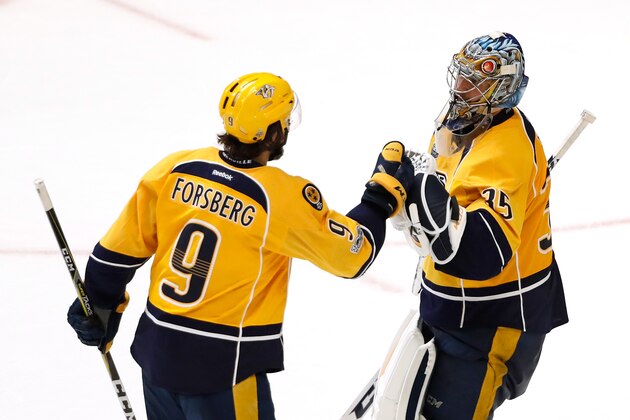 NASHVILLE, TN - JUNE 03:  Pekka Rinne #35 of the Nashville Predators celebrates with Filip Forsberg #9 after defeating the Pittsburgh Penguins 5-1 in Game Three of the 2017 NHL Stanley Cup Final at the Bridgestone Arena on June 3, 2017 in Nashville, Tennessee.  (Photo by Justin K. Aller/Getty Images)