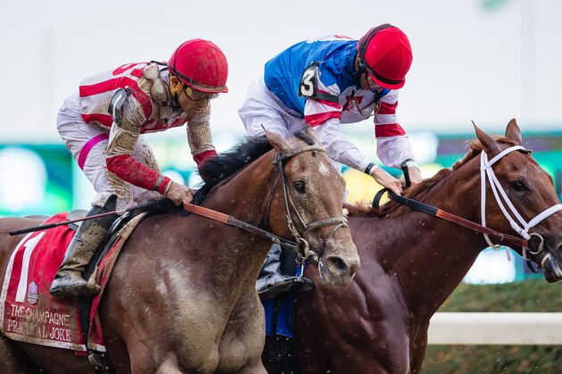 ELMONT, NY - OCTOBER 08: Practical Joke #1 (left), ridden by Joel Rosario, catches Syndergaard #3, ridden by John Velazquez at the wire to win by a nose in the Champagne Stakes on Jockey Club Gold Cup Day at Belmont Park on October 8, 2016 in Elmont, New York. (Photo by Doug DeFelice/Eclipse Sportswire/Getty Images)
