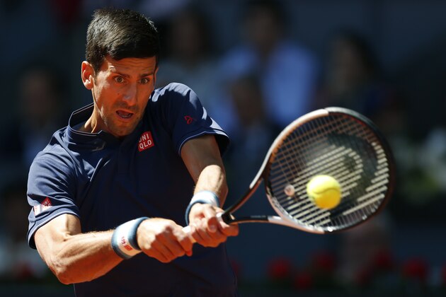 Novak Djokovic of Serbia hits a return to Rafael Nadal of Spain during their mens semifinal tennis match at the Madrid Open tennis tournament in Madrid, Spain, Saturday, May 13, 2017. (AP Photo/Francisco Seco)