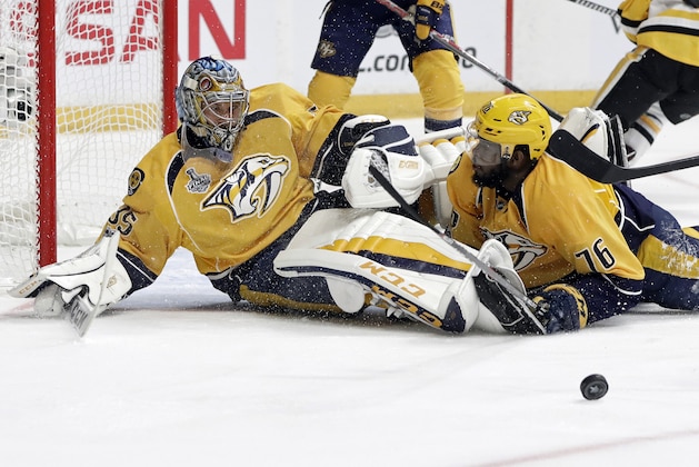Nashville Predators goalie Pekka Rinne (35), of Finland, and defenseman P.K. Subban (76) stop a shot by the Pittsburgh Penguins during the second period in Game 3 of the NHL hockey Stanley Cup Finals Saturday, June 3, 2017, in Nashville, Tenn. (AP Photo/Mark Humphrey)