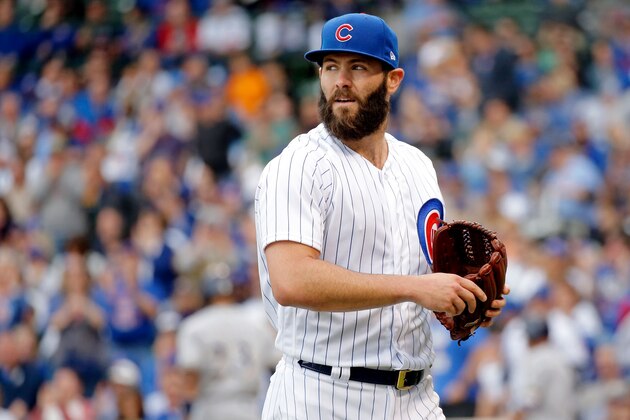 CHICAGO, IL - MAY 21: Jake Arrieta #49 of the Chicago Cubs looks back at a replay after striking out Keon Broxton #23 of the Milwaukee Brewers (not pictured) to end the fourth inning at Wrigley Field on May 21, 2017 in Chicago, Illinois. (Photo by Jon Durr/Getty Images)
