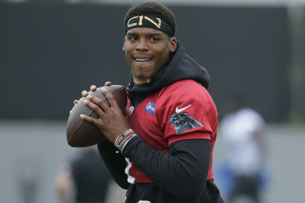 Carolina Panthers' Cam Newton (1) runs a drill in practice during the NFL football team's organized team activities in Charlotte, N.C., Tuesday, May 30, 2017. (AP Photo/Chuck Burton)
