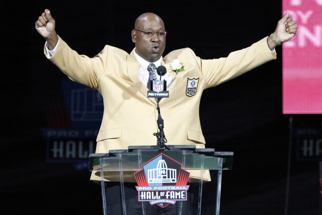 Former NFL player Cortez Kennedy gestures during his induction at the Pro Football Hall of Fame on Saturday, Aug. 4, 2012, in Canton, Ohio. (AP Photo/Tom E. Puskar)