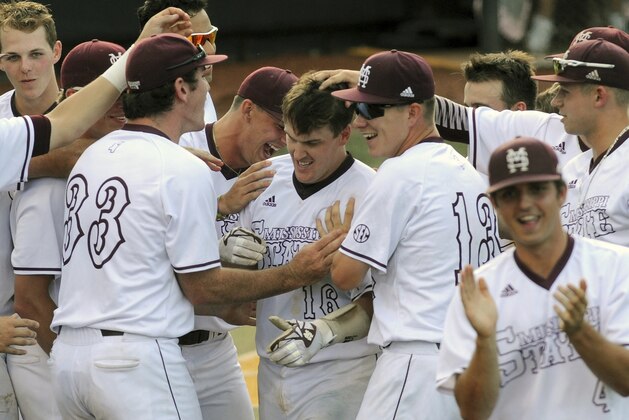 Mississippi State's Josh Lovelady, center, is congratulated by teammates after hitting a three-run homer as they take on Southern Mississippi during their NCAA regional college baseball game Monday, June 5, 2017, in Hattiesburg, Miss. (Ryan Moore/WDAM, via AP)