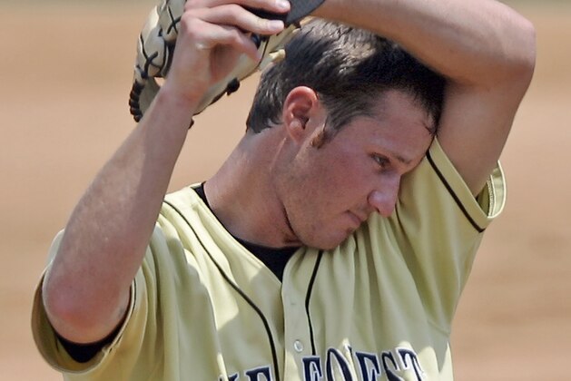 Wake Forest's Justin Keadle wipes his face after walking Miami's Jon Jay in the fifth inning during the 2006 ACC Baseball Championship, Thursday, May 25, 2006, in Jacksonville, Fla. (AP Photo/Alan Diaz)