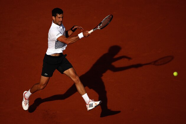PARIS, FRANCE - JUNE 04: Novak Djokovic of Serbia plays a forehand in the mens singles fourth round match against Albert Ramos-Vinolas of Spain  on day eight of the 2017 French Open at Roland Garros on June 4, 2017 in Paris, France.  (Photo by Julian Finney/Getty Images)