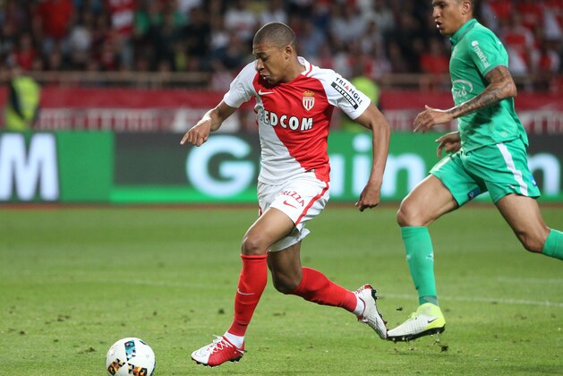 MONACO, MONACO - MAY 17: Kylian Mbappe of Monaco goes past goalkeeper of Saint-Etienne Stephane Ruffier to score his goal during the French Ligue 1 match between AS Monaco and AS Saint-Etienne (ASSE) at Stade Louis II on May 17, 2017 in Monaco, Monaco. (Photo by Jean Catuffe/Getty Images)