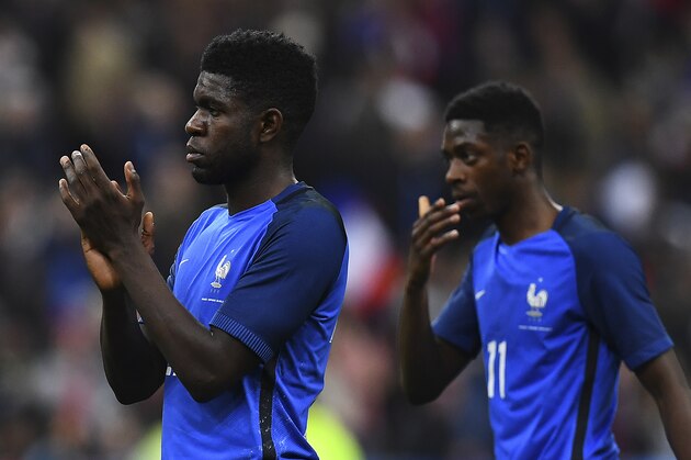 France's defender Samuel Umtiti and France's forward Ousmane Dembele react at the end of the friendly football match France vs Spain on March 28, 2017 at the Stade de France stadium in Saint-Denis, north of Paris.  / AFP PHOTO / FRANCK FIFE        (Photo credit should read FRANCK FIFE/AFP/Getty Images)