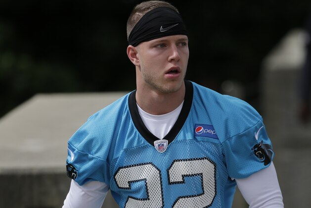 Carolina Panthers' Christian McCaffrey (22) walks to the field before his first practice at the NFL football team's rookie camp in Charlotte, N.C., Friday, May 5, 2017. (AP Photo/Chuck Burton)
