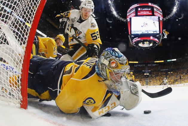 NASHVILLE, TN - JUNE 05:  Pekka Rinne #35 of the Nashville Predators makes a glove save against Jake Guentzel #59 of the Pittsburgh Penguins during the second period in Game Four of the 2017 NHL Stanley Cup Final at the Bridgestone Arena on June 5, 2017 in Nashville, Tennessee.  (Photo by Bruce Bennett/Getty Images)