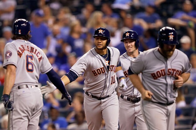 KANSAS CITY, MO - JUNE 05:  Yuli Gurriel #10 of the Houston Astros is congratulated by Jake Marisnick #6 after hitting a 3-run home run during the 9th inning of the game against the Kansas City Royals at Kauffman Stadium on June 5, 2017 in Kansas City, Missouri.  The Astros defeated the Royals with a final score of 7-3.  (Photo by Jamie Squire/Getty Images)