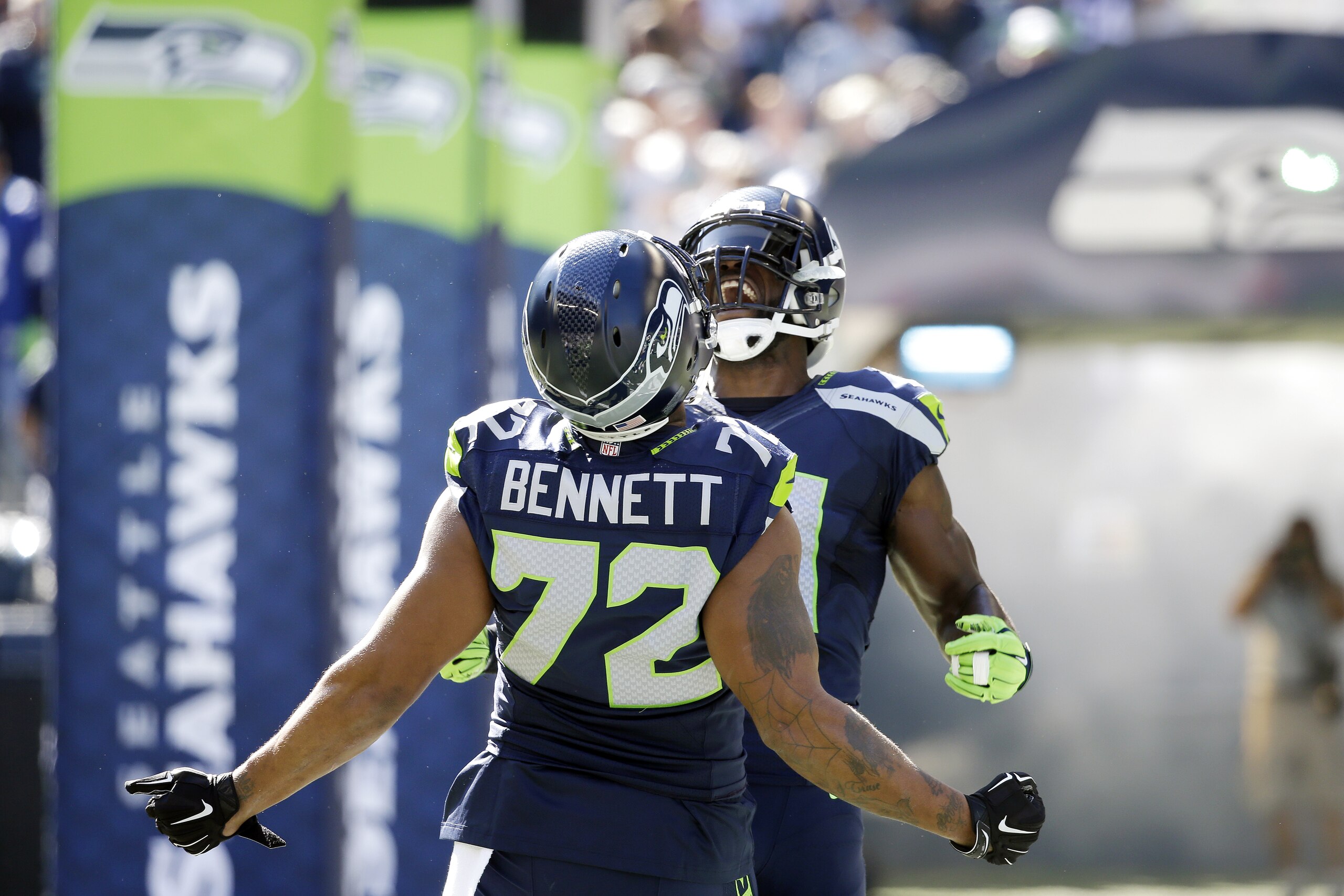 Seattle Seahawks' Kam Chancellor, right, is greeted by Michael Bennett (72) during player introductions before an NFL football game against the Chicago Bears, Sunday, Sept. 27, 2015, in Seattle. (AP Photo/Elaine Thompson) Seattle Seahawks' Kam Chancellor, right, is greeted by Michael Bennett (72) during player introductions before an NFL football game against the Chicago Bears, Sunday, Sept. 27, 2015, in Seattle. (AP Photo/Elaine Thompson)