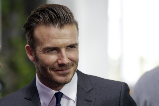 Former English soccer star David Beckham is shown after a news conference where he announced he will exercise his option to purchase a Major League Soccer expansion team in Miami, Wednesday, Feb. 5,  2014, in Miami. (AP Photo/Lynne Sladky)