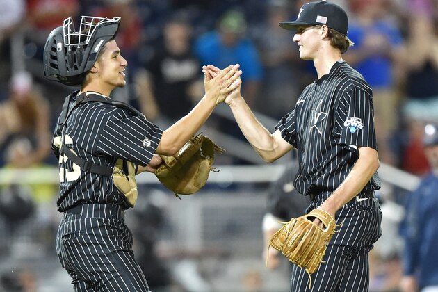 Omaha, NE - JUNE 22: Pitcher Kyle Wright #44 of the Vanderbilt Commodores celebrates with catcher Karl Ellison #25 after beating the Virginia Cavaliers 5-1 during game one of the College World Series Championship Series on June 22, 2015 at TD Ameritrade Park in Omaha, Nebraska. (Photo by Peter Aiken/Getty Images) Omaha, NE - JUNE 22: Pitcher Kyle Wright #44 of the Vanderbilt Commodores celebrates with catcher Karl Ellison #25 after beating the Virginia Cavaliers 5-1 during game one of the College World Series Championship Series on June 22, 2015 at TD Ameritrade Park in Omaha, Nebraska. (Photo by Peter Aiken/Getty Images)