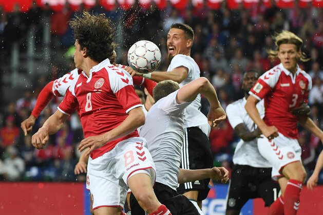 Germany´s Matthias Ginter and Denmark´s Thomas Delaney vie for the ball during the friendly football match between Denmark and Germany in Brondby, Denmark on June 6, 2017. / AFP PHOTO / PATRIK STOLLARZ        (Photo credit should read PATRIK STOLLARZ/AFP/Getty Images)