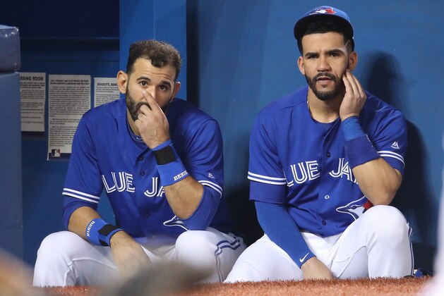 TORONTO, ON - JUNE 1: Jose Bautista #19 and Devon Travis #29 of the Toronto Blue Jays look on from the top step of the dugout during MLB game action against the New York Yankees at Rogers Centre on June 1, 2017 in Toronto, Canada. (Photo by Tom Szczerbowski/Getty Images)