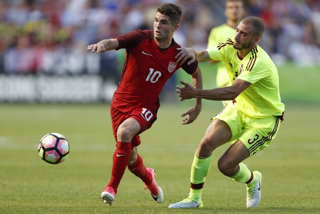 SANDY, UT - JUNE 3:  United States midfielder Christian Pulisic #10 fights for the ball with Venezuela's defender Mikel Villanueva #3 during the first half of an international friendly soccer game on June 3, 2017 at Rio Tinto Stadium in Sandy, Utah. (Photo by George Frey/Getty Images)