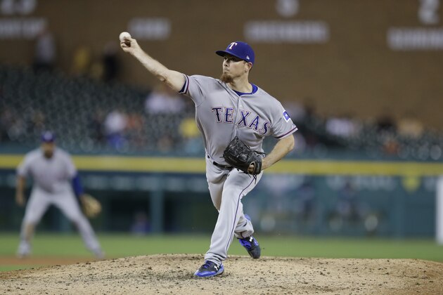 Texas Rangers relief pitcher Sam Dyson throws during the ninth inning of a baseball game against the Detroit Tigers, Sunday, May 21, 2017, in Detroit. (AP Photo/Carlos Osorio)