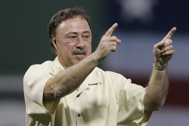 Former Boston Red Sox and Los Angeles Angels Hall of Fame second baseman and current Red Sox broadcaster Jerry Remy reacts after throwing out the ceremonial first pitch before Game 1 of an American League Division Series playoff baseball game between the Red Sox and Angels Wednesday, Oct. 3, 2007 in Boston. (AP Photo/Elise Amendola)