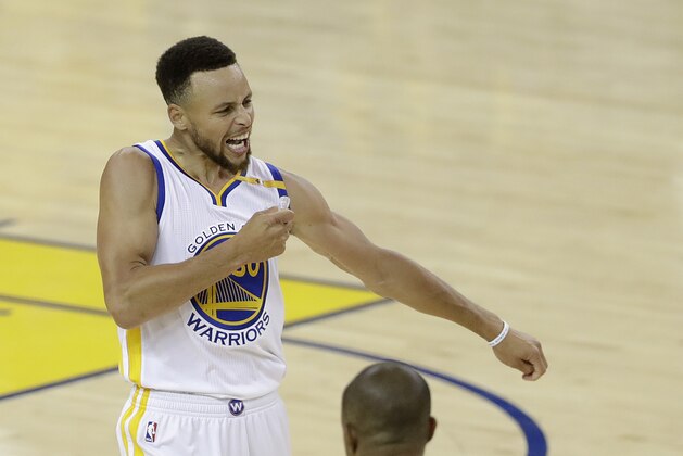 Golden State Warriors guard Stephen Curry (30) reacts after scoring against the Cleveland Cavaliers during the second half of Game 2 of basketball's NBA Finals in Oakland, Calif., Sunday, June 4, 2017. (AP Photo/Marcio Jose Sanchez)