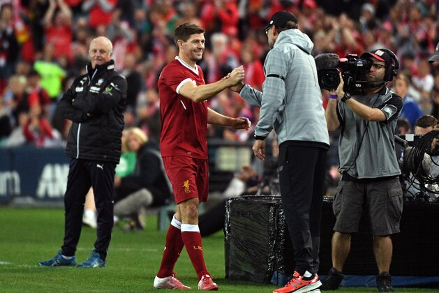 Liverpool player Steven Gerrard (2nd L) shakes hands with coach Jurgen Klopp after being substituted during their end-of-season friendly football match against Sydney FC at the Olympic Stadium in Sydney on May 24, 2017. / AFP PHOTO / WILLIAM WEST        (Photo credit should read WILLIAM WEST/AFP/Getty Images)