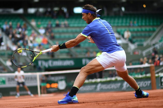 Spain's Rafael Nadal returns the ball to Spain's Pablo Carreno Busta during their tennis match at the Roland Garros 2017 French Open on June 7, 2017 in Paris.  / AFP PHOTO / CHRISTOPHE SIMON        (Photo credit should read CHRISTOPHE SIMON/AFP/Getty Images)