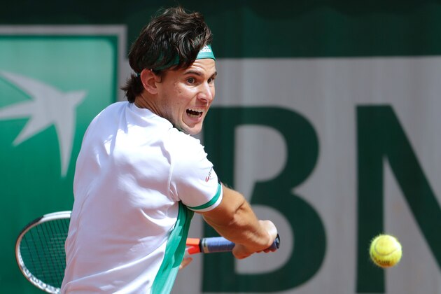 Austria's Dominic Thiem returns the ball to Serbia's Novak Djokovic during their tennis match at the Roland Garros 2017 French Open on June 7, 2017 in Paris. / AFP PHOTO / Thomas SAMSON (Photo credit should read THOMAS SAMSON/AFP/Getty Images) Austria's Dominic Thiem returns the ball to Serbia's Novak Djokovic during their tennis match at the Roland Garros 2017 French Open on June 7, 2017 in Paris. / AFP PHOTO / Thomas SAMSON (Photo credit should read THOMAS SAMSON/AFP/Getty Images)